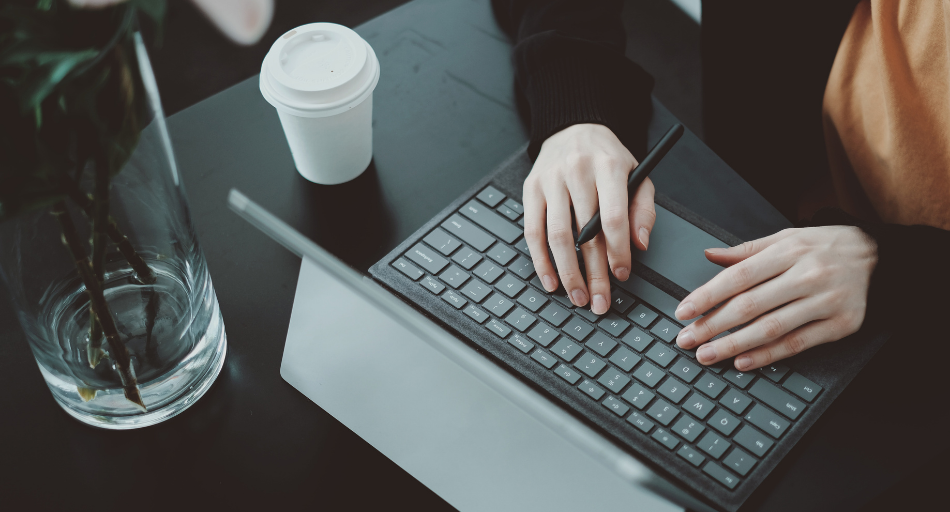 hands typing on keyboard