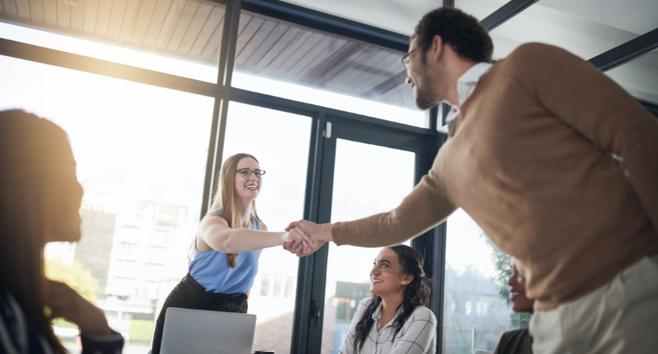 professionals shaking hands during onboarding