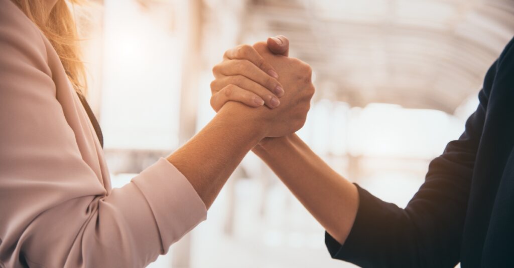 recruiter shaking hands with candidate